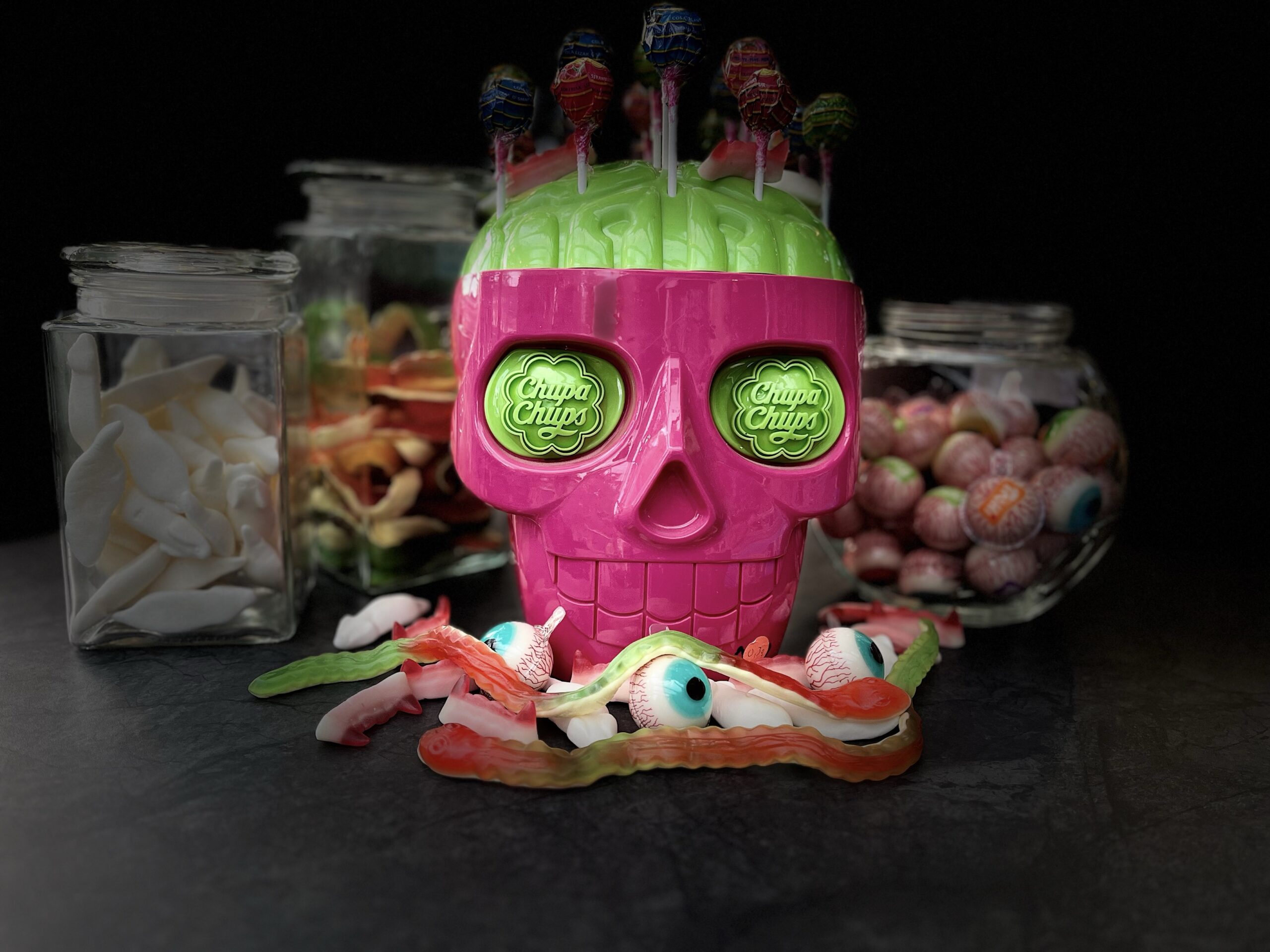 a pink skull with candy on top of it